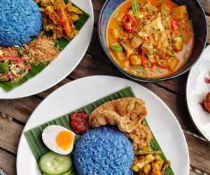 Blue pea flower herb rice with skate curry from Malaysian Nyonya Supper Club; photograph by Guan Chua